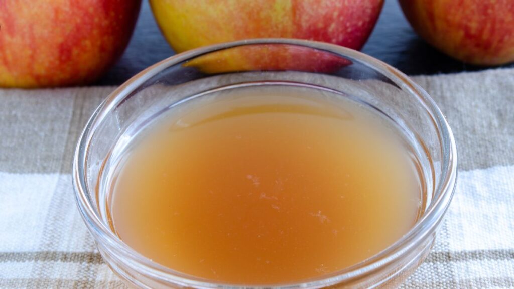 Small bowl of apple cider vinegar deodorizer sitting on kitchen counter.