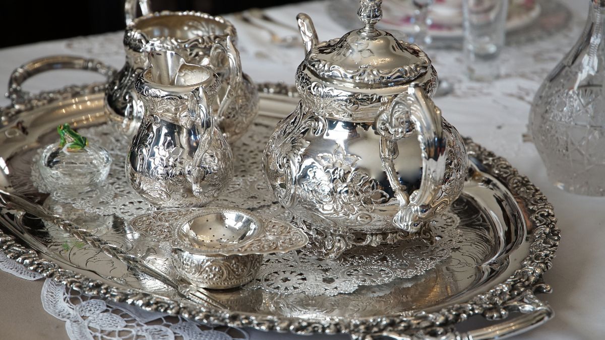Restoring shine to tarnished silverware with baking soda paste.