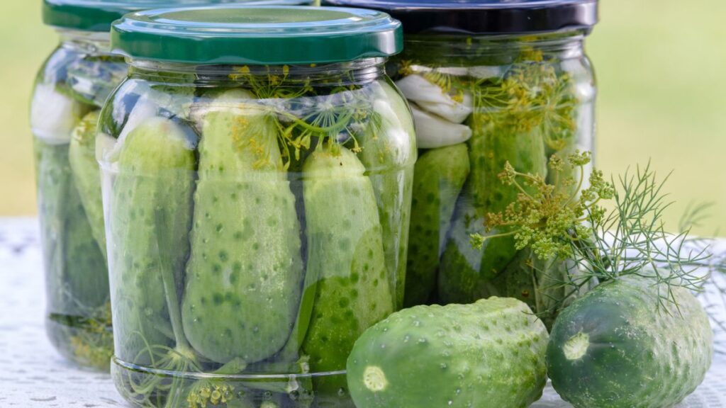 Jar of vegetables pickled in apple cider vinegar with spices.
