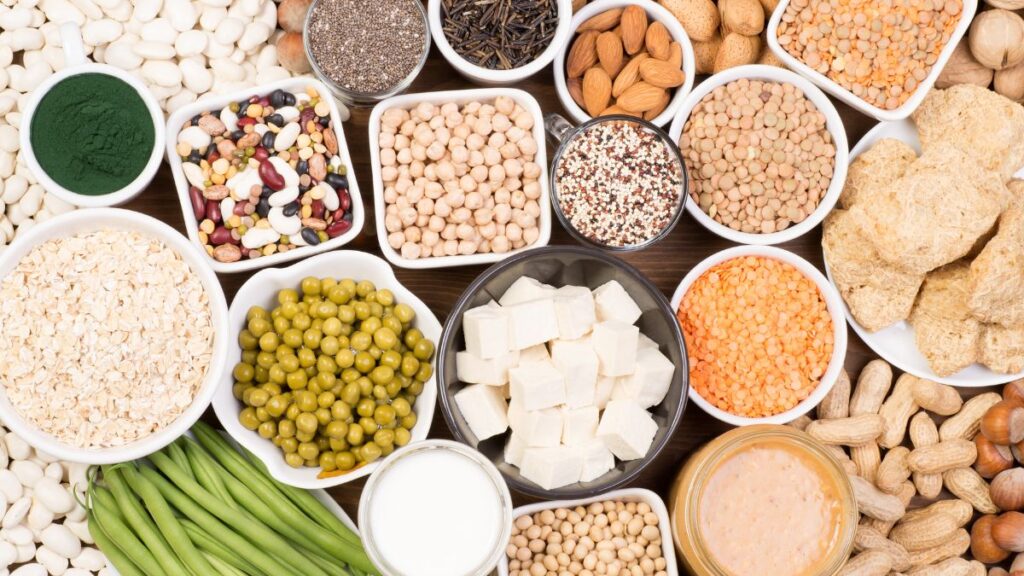 Bowls of beans, tofu, lentils, and nuts for affordable protein.