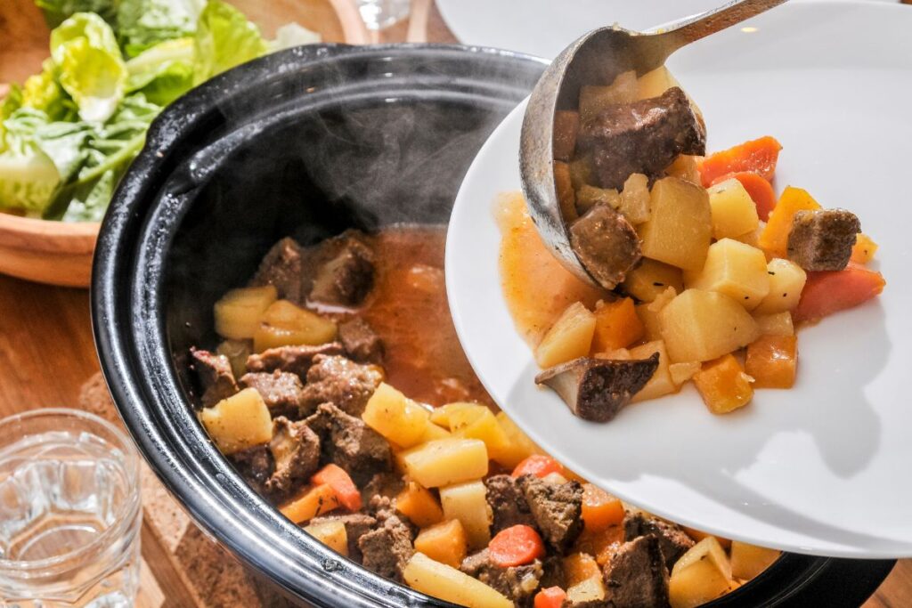 Slow cooked meal being served on a plate.