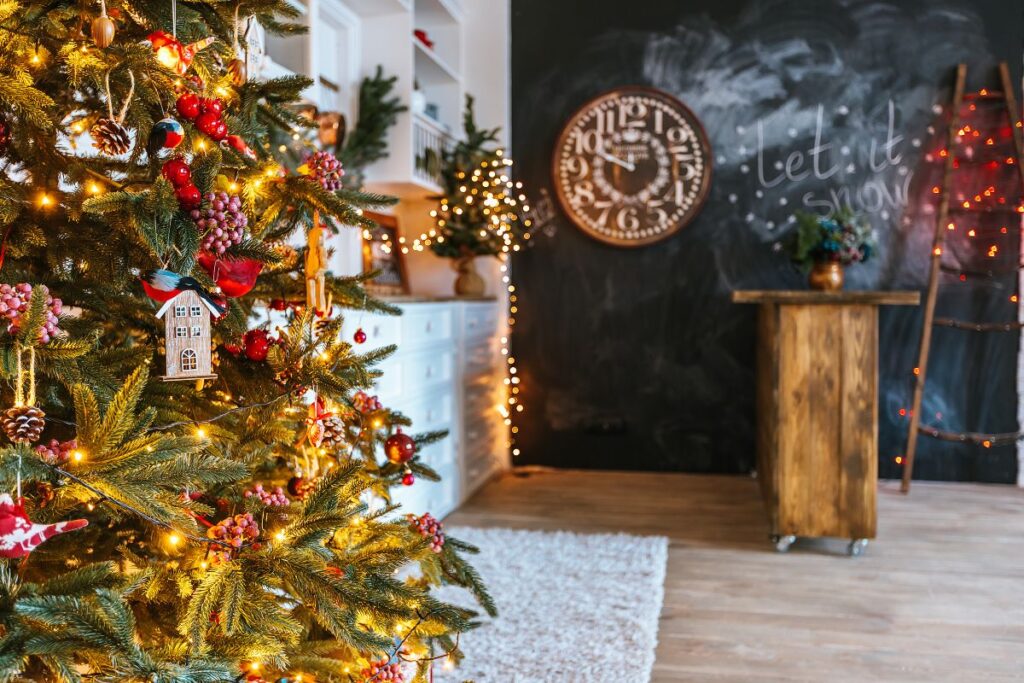 Christmas tree glowing with holiday lights in a cozy family living room.
