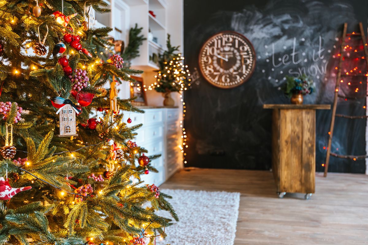 Christmas tree glowing with holiday lights in a cozy family living room.