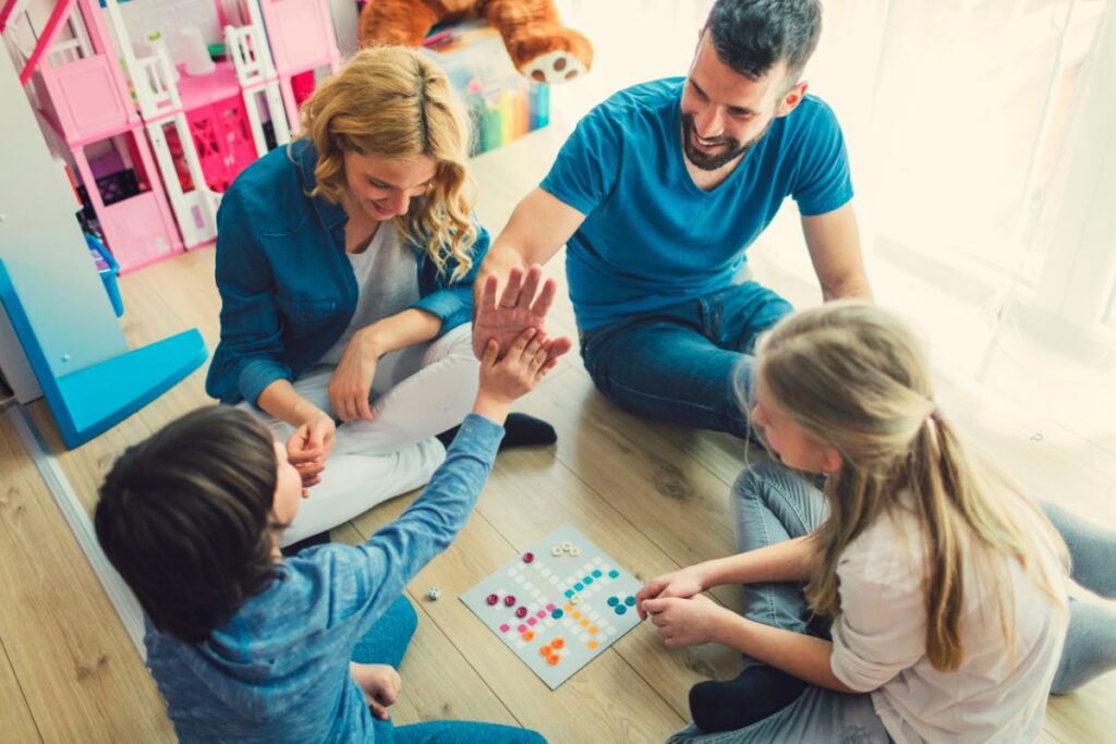 Famiy playing board game together.