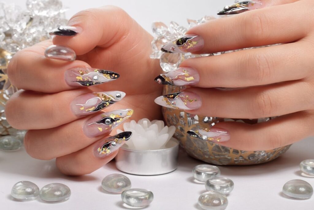 Silver and gold metallic abstract nail art for winter style.