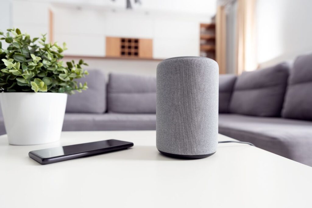 Smart speaker placed on a coffee table in the living room.