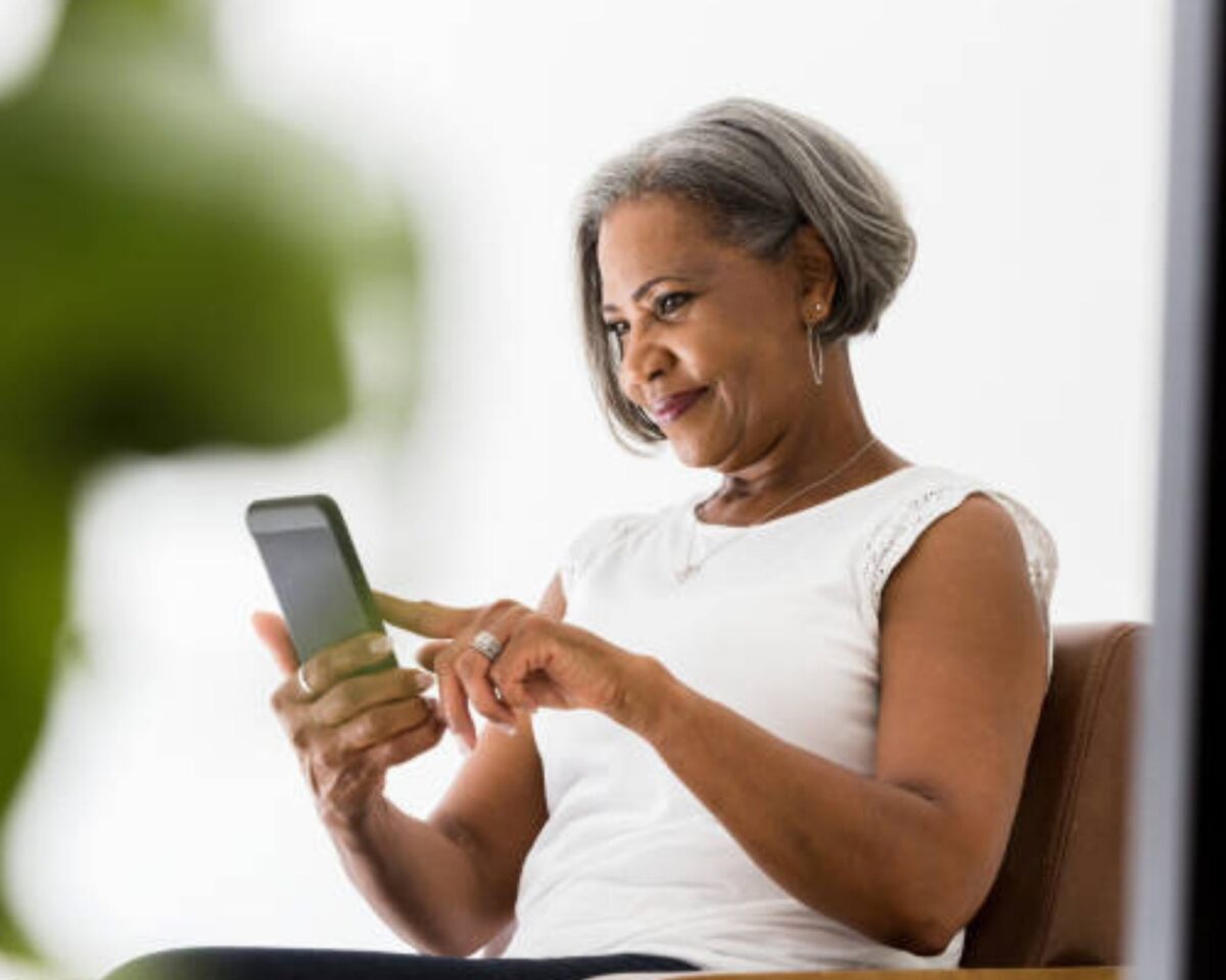 An elderly lady using phone.