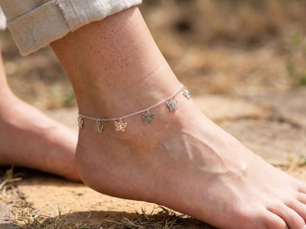 Ankle wearing butterfly charm anklet outdoors