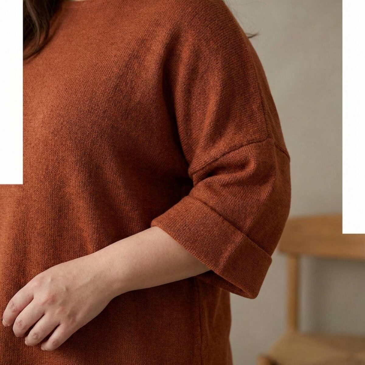 Close-up of a three-quarter sleeve with a defined cuff on a fitted top.